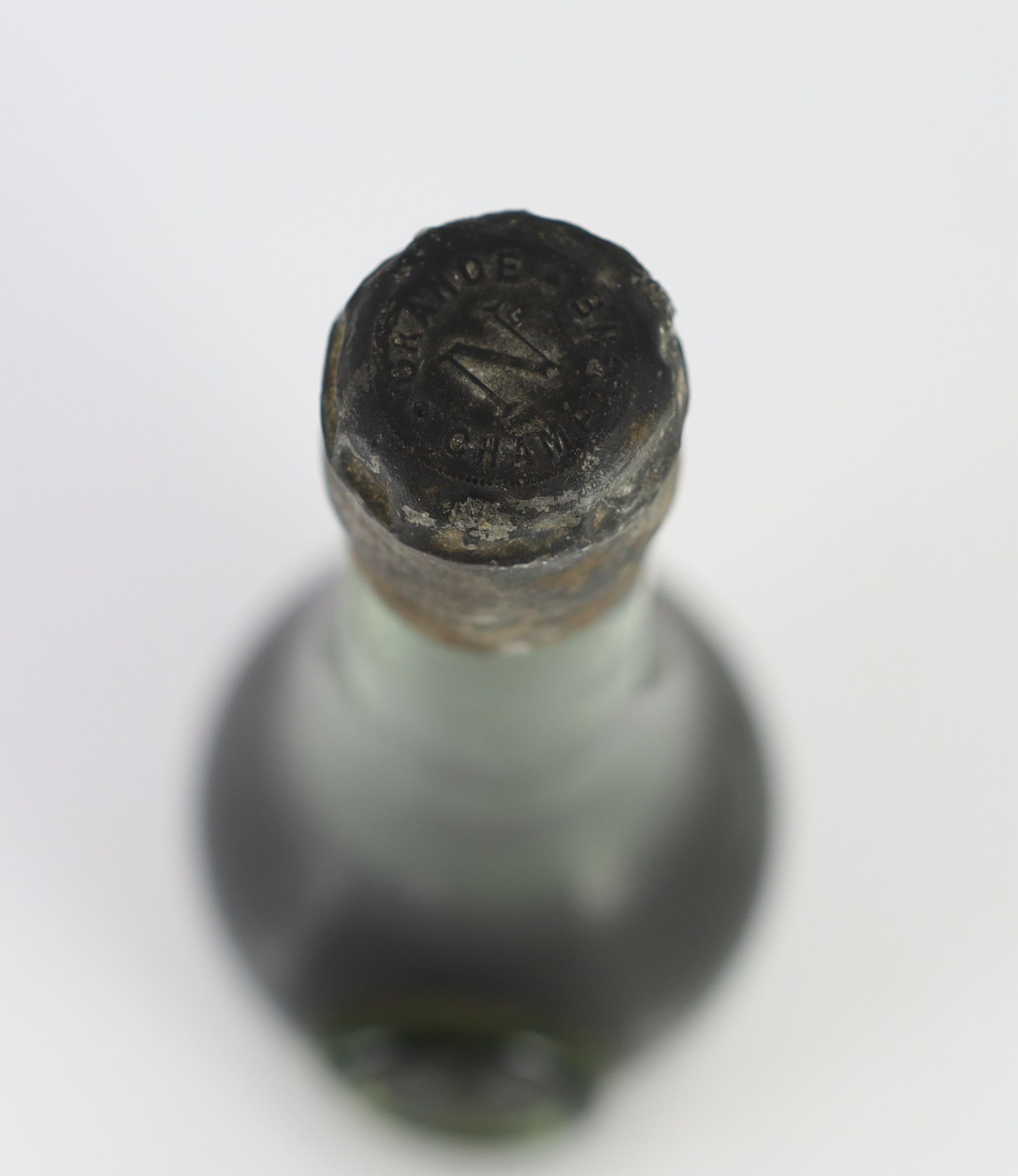 A bottle of Napoleon Grand Champagne Cognac, lacks label